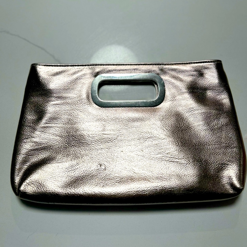 Brand new without tags never used gold metallic clutch